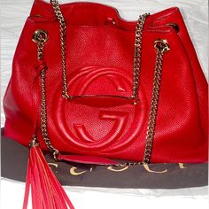 Details: Moderate Wear On Corners Exterior; Interior: Obvious Stains -Comes With Authentic Dust Bag Description: Gucci Tote, Red Leather, Interlocking G Logo, Chain-Link Shoulder Straps, Tassel Accents, Canvas Lining Details: Shoulder Strap: 9” Height: 10.25” Width: 14.25” Depth: 5.75” Questions? Leave A Comment Below! Red Gucci Shoulder Bag, High-end Red Bags With Gold-tone Hardware, High-end Red Shoulder Bag With Branded Hardware, Gucci Red Shoulder Bag With Gold-tone Hardware, Luxury Red Shoulder Bag With Gold-tone Hardware, G Logo, Gucci Tote, Gucci Bags, Womens Tote Bags