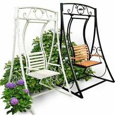 a white swing chair next to a planter with purple flowers