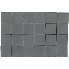 a gray tile wall that is made out of small squares