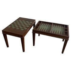 two tables with chess boards on them, one is brown and the other is green