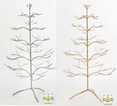 three different types of metal trees in various sizes and shapes, one with branches on each side