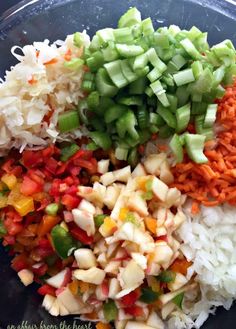 chopped up vegetables are in a bowl on top of rice and broccoli florets