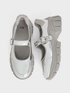 A cool, modern take on Mary Janes, this pair features a hybrid design that is sure to stand out and steal the spotlight. The shoes showcase curved, chunky soles inspired by dad sneakers, providing a boost in height while adding a spring to your step. The striking metallic finish, featuring a distressed leather effect, creates an eye-catching element while remaining versatile enough to pair with a wide range of outfits, thanks to the understated elegance of silver. Dad Sneakers, Hybrid Design, Steal The Spotlight, Charles Keith, Distressed Leather, Understated Elegance, Metallic Leather, Sneakers Athletic, Recycled Fabric