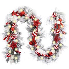 the letter u is decorated with candy canes and christmas decorations, including ornaments such as wreaths