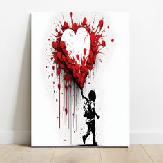 a heart shaped painting on a white wall next to a wooden floor with a person holding a red balloon