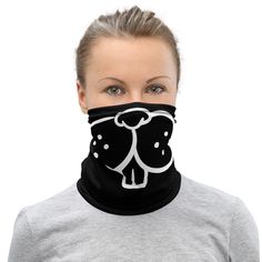 a woman wearing a black and white neck gaiter with an image of a dog on it