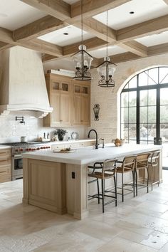 a large kitchen with an island in the middle