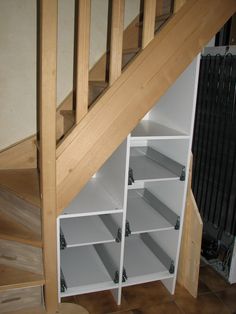 an under stair storage unit underneath a staircase