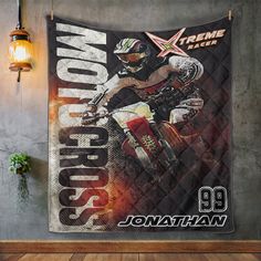 a wall hanging with a dirt bike poster on it