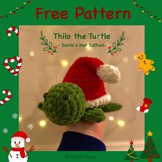 a crocheted turtle in a santa's hat on top of a person's hand