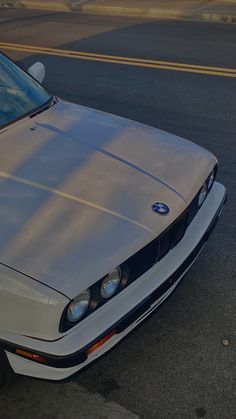 a silver car parked on the side of the road