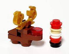 two legos are sitting next to each other on a white surface, one is red and the other is yellow