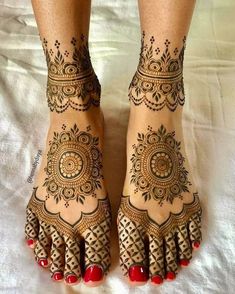 the feet are decorated with henna designs