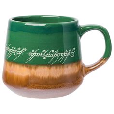 a green and brown mug with white writing on it