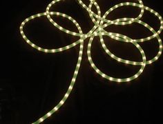 a light up shamrock with green lights on it