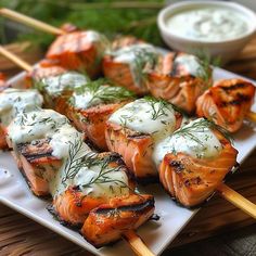 salmon and cream cheese skewers on a white plate