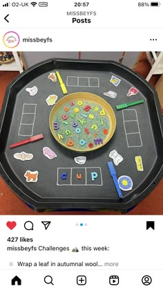 a black tray with writing and pictures on it