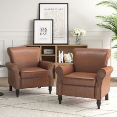 two brown leather chairs sitting next to each other