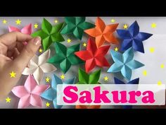 origami paper flowers with the words sakura written in front of them