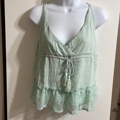 Mint Green Honey Punch Spaghetti Strap Tank With Adjustable Cross Cross Straps Never Worn Green Cotton Camisole For Vacation, Casual Camisole Top For Beach Season, Beach Season Camisole For Day Out, Casual Spring Beach Camisole, Beach Season Camisole Tops For Day Out, Camisole Tops For Beach Season Day Out, Green Casual Camisole For Vacation, Casual Green Camisole For Vacation, Spring Beach Tops With Spaghetti Straps