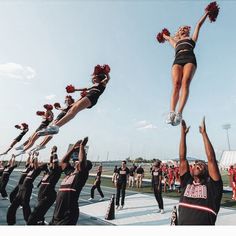 the cheerleaders are doing stunts for the crowd