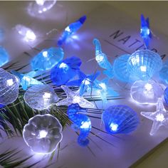 PRICES MAY VARY. 🐟【Handmade Strings light】 Total Length 12.96ft, With 40 Seashell Cold White Led Lights. Every String Is Handmade And Looks Amazing. the copper wire is waterproof and durable, also flexible enough to make various shapes. It is an ideal choice for your various decoration plans. ⭐【8 modes Remote Control and Battery operated】You can put the string light anywhere you want, such as a place there is no plug in around or high and difficult to reach. You can control the light through re Patio Wedding, Beach Themed Bedroom, Coastal Room, Outdoor Birthday, Stella Marina, Ocean Decor, Aquarium Decorations, Beach Theme, Outdoor Ceiling Fans