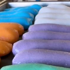 doughnuts and pastries are lined up in rows