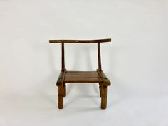 a wooden chair sitting on top of a white floor