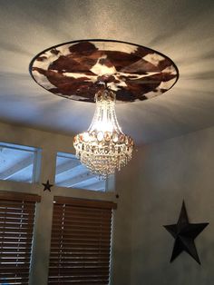 a chandelier hanging from the ceiling in a room