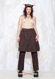 Get funky with this Y2K vintage cargo skirt! Embrace the gorpcore meets grungey vibes! Features: - four pockets - button closure - 100% cotton Every item we manage is cleaned and, when necessary, repaired, ensuring it arrives to you in top condition. Our model, Sawa is 170 cm / 66.3" tall and she's a size XXL. Size: XL / US 10 / UK 14 / IT 46 Other size info: Labelled size: 42 Measurements:  waist (seam to seam): 45 cm / 17.6" length: 58 cm / 22.6" Fabric: cotton 100% Care: Machine wash inside o 2000s Midi Skirt, Get Funky, Cargo Skirt, Style Expert, Pleated Midi Skirt, Label Sizes, Y2k Vintage, Fabric Cotton, Vintage Y2k