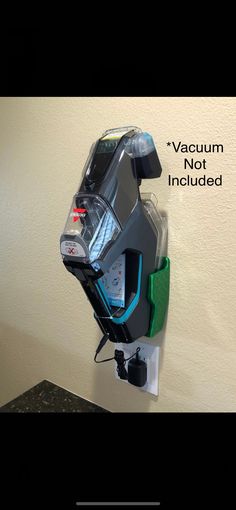 the vacuum is not included on this wall mounted holder, and it's attached to the wall