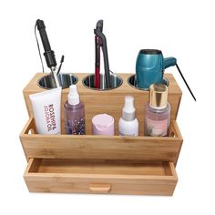 a wooden container filled with cosmetics and other items