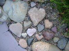 rocks and gravel are arranged in the shape of hearts