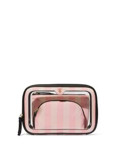 Triple the glam. This iconic stripe trio fits everything you could ever need. Together or separate, the clear exterior to helps you quickly find what you’re looking for. Fits: Mists, lotions, makeup brushes, lipsticks Exterior bag with two interior bags Measures: Measures: 6” H X 9” L x 2 3/4 W Polyurethane and embossed nylon Victoria Secret Toiletry Bag, Vs Makeup Bag, Rhode Makeup, Expensive Wishlist, Designer Makeup Bags, فيكتوريا سيكريت, Victoria Secret Makeup Bag, Designer Makeup Bag, Anna Clara