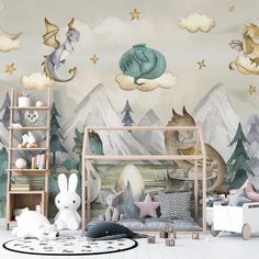 a child's room decorated in pastel colors with mountains and stars on the wall