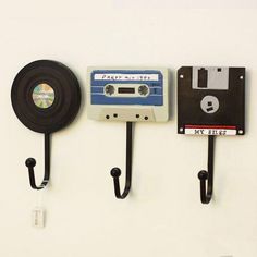 there are three wall hooks with tapes attached to them