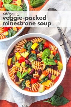 two bowls filled with pasta and vegetables on top of a table next to silverware