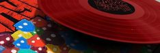 a red frisbee sitting on top of a pile of colorful paper towels and polka dots