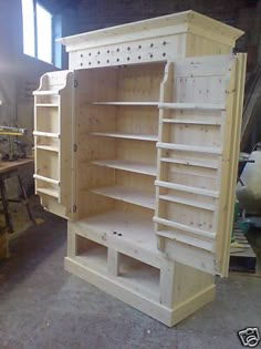 an unfinished cabinet is being worked on in a shop