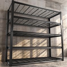 an empty metal shelving unit against a concrete wall