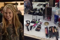 a woman standing next to a table filled with makeup