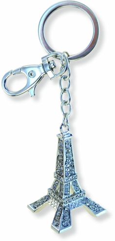 the eiffel tower keychain is made out of metal and has swarong crystals