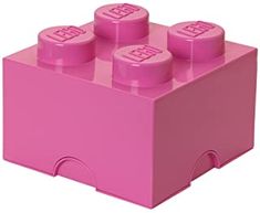 a pink lego brick with four small round knobs