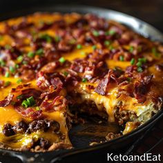 a close up of a pizza with cheese and bacon