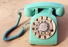 an old - fashioned phone is sitting on the table