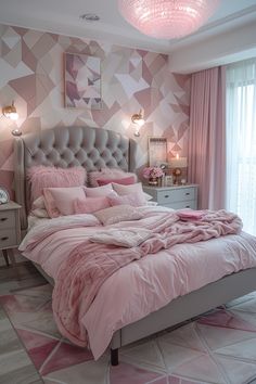 a bedroom with pink bedding and pillows