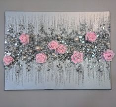 pink roses and silver sequins on a canvas