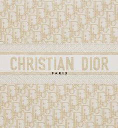 Introduced by Maria Grazia Chiuri, Creative Director of Christian Dior, the Dior Book Tote has become a staple of the Dior aesthetic. Designed to hold all the daily essentials, the style is fully embroidered with a white and gold-tone Dior Oblique motif. Adorned with the Christian Dior Paris signature on the front, the large tote exemplifies the House's signature savoir-faire and may be carried by hand or worn over the shoulder.. Dior Wallpaper, Dior Aesthetic, Dior Book, Christian Dior Paris, Dior Star, Dior Paris, Dior Oblique, Book Tote Bag, Dior Book Tote