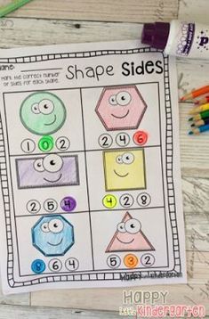 a printable shape and number worksheet with colored pencils next to it