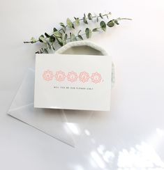 a white envelope with pink flowers on it